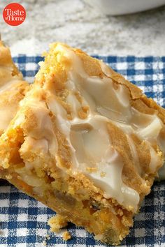 two pieces of cake sitting on top of a blue and white checkered cloth