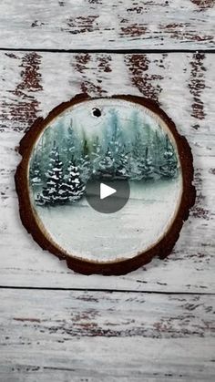 an image of a snowy forest with trees in the background on a white wooden surface