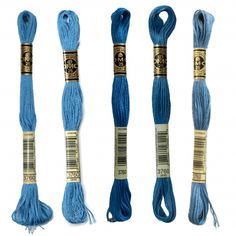 three skeins of blue yarn in different sizes