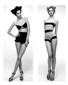 two models in black and white swimsuits, one is wearing a floppy hat