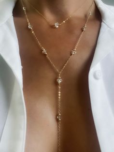 Mantra: “I align & vibrate with the purest light.” Symbolism: Dreams, visions, purifying energy, guidance, strength & protection. Manifest your dreams and ambitions with the transparent and brilliant sparkle of Herkimer Diamonds and adorn in our Pure Light Lariat Necklace. DETAILS Adjustable 16" to 18" or 18" to 20" chain with a 5" lariat drop. 5-6mm Herkimer diamonds handwoven with 3mm beads. Lobster clasp closure. Available in sterling silver or 14k gold filled. Luxury Lariat Necklace With Diamond Accents As A Gift, Luxury Formal Lariat Diamond Necklace, Luxury Long Drop Backdrop Diamond Necklace, Luxury Gold Beaded Dangle Jewelry, Luxury White Gold Lariat Drop Necklace, Luxury Single Strand Dangle Necklaces, Luxury Diamond Lariat Necklace In Fine Jewelry Style, Luxury Diamond Accents Lariat Necklace For Women, Luxury Fine Jewelry Gold Chain