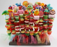 a bunch of candy lollipops are arranged on top of eachother