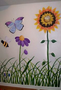 a wall with flowers and butterflies painted on it