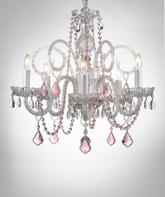 a chandelier with pink crystals hanging from the ceiling