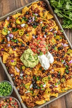 an overhead view of a tray of taco casserole with tortilla shells and salsa