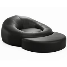 a black leather chair and ottoman sitting next to each other