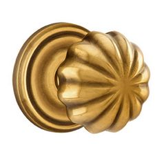 an antique brass door knob with a flower design on the front and back of it