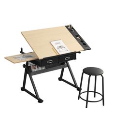 a drawing table with two stools next to it and an open book on top