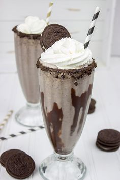 two glasses filled with ice cream and oreo cookies