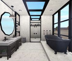 a bathroom with two sinks and a bathtub next to a window in the ceiling