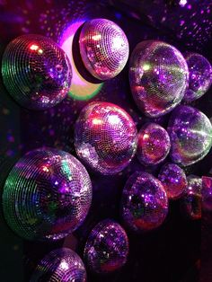 many shiny disco balls are in the dark