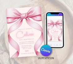 a cell phone next to a pink birthday party card with a bow on the front