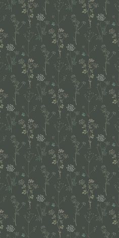 a green wallpaper with small flowers and leaves on the bottom half of it, against a dark background