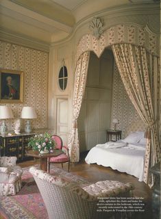 an open book showing a bedroom with curtains and furniture