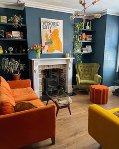 a living room filled with furniture and a fire place in front of a tv mounted on a wall