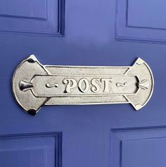 a blue door with a sign that says post on the front and side of it