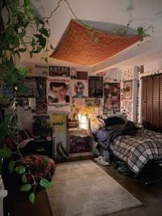 a bedroom with posters on the wall and a bed