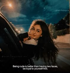 a woman sitting in the passenger seat of a car with her hand on her face