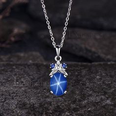 Item description ✦ Handmade, high-quality item! ✦ Material: 925 sterling silver, Solid 14K/18K GOLD (can be made in white/rose/yellow gold), Platinum ✦ Center Stone: 7x9mm Oval Cut Lab Blue Star Sapphire ✦ Side Stones: Round Cut Lab Blue Sapphires ✦ Chain length can be adjusted between 16 inches and 18 inches As it is handmade, it needs 2-4 weeks to finish and then be shipped by USPS or FedEx. Return policy: We offer 30 days return policy. For any reason, if you are not completely satisfied with Blue Star-shaped Gemstone Necklace, Star Shaped Sapphire Jewelry Gift, Silver Sapphire Oval Necklace, Silver Oval Sapphire Necklace, Silver Oval Celestial Necklace, Celestial Silver Oval Necklace, Oval Sapphire Silver Necklace, Blue Sapphire Jewelry In Oval Cabochon Shape, Blue Gemstone Necklace With Oval Cabochon