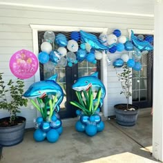 some balloons and decorations are on the front porch