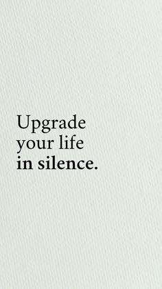 the words upgrade your life in silence are written on a white paper with black lettering