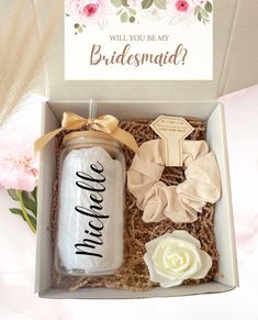 the bridesmaid gift box is filled with personalized items for her special day