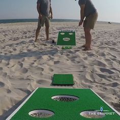 two men playing mini golf on the beach