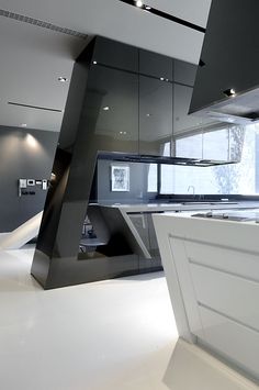 a modern kitchen with black and white accents