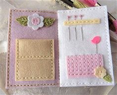 two handmade felt cards with flowers and pins on them, one is pink and the other is white