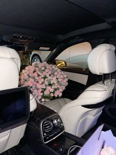 the interior of a car with flowers in it