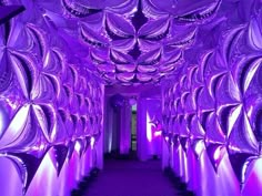 the inside of a room with purple lights