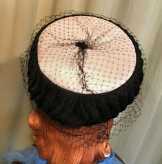 "This is a charming mid century, vintage, pillbox hat. No labels or tags, only a Union label. This pretty hat is made of pleated black fabric around the sides & smooth white fabric top. It is covered in a medium net veil. The hat measures 20\" around the inside, but really is a one size, pillbox hat, as it just perches on the head. The hat is in very good condition. No damage or soil. There are a few breaks in the netting. So sweet!" Adjustable Retro Headpiece For Evening, Adjustable Vintage Headpieces For Vintage Events, Vintage Curved Brim Top Hat For Royal Ascot, Vintage Bonnet With Adjustable Short Brim, Vintage Black Cloche Hat With Curved Brim, Vintage Adjustable Bonnet With Short Brim, Black Vintage Cloche Hat With Curved Brim, Vintage Brimmed Evening Hat, Vintage Short Brim Bonnet With Adjustable Fit