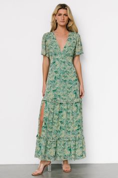 Jump into spring with our Audrey Deep V Maxi Dress in Green Floral! This dress features beautiful, nature-inspired colors and flowy material that you're sure to love. Green Flowy V-neck Floral Dress, Chic Green V-neck Floral Dress, Feminine Green Floral V-neck Dress, Deep V Maxi Dress, Feminine Floral Print V-neck Maxi Dress, Green Floral Print Maxi V-neck Dress, Photoshoot Dress, Green Floral Dress, Maxi Dress Green