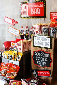 popcorn bar with signs and candies on display