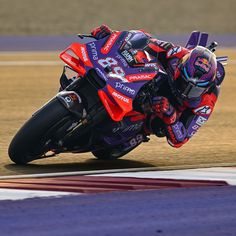 a person riding a motorcycle on a race track