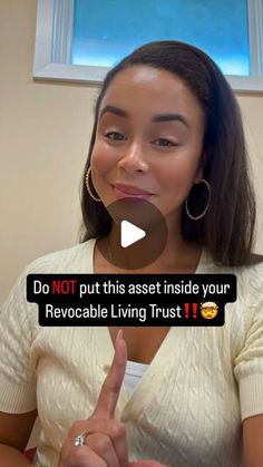 a woman is giving the peace sign with her hand and saying do not put this asset inside your revocable living trust