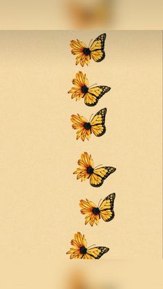 a group of yellow butterflies flying through the air