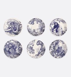 six blue and white plates with animals on them