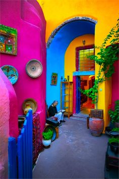 the front cover of a magazine with an image of colorful houses and doorways in different colors