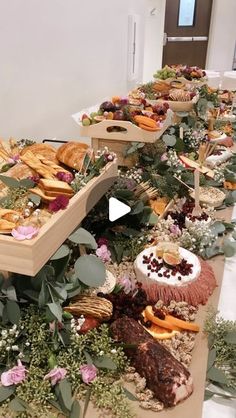 a long table filled with lots of different types of food on top of each other