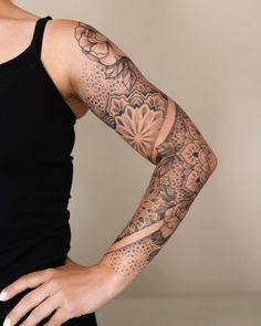 a woman with a tattoo on her arm