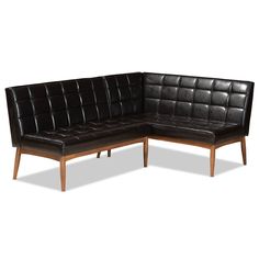 a black leather sectional sofa with wooden legs