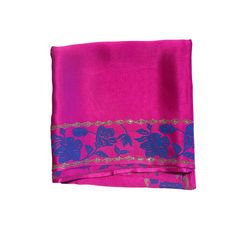 Maharani pink organic peace silk scarf with hand block printed floral motifs on the borders. The motifs have lotus and hibiscus flowers with little stylized leaves.  The base fabric is from a Gots certified peace silk manufacturer, who ensures that the silkworms hatch out of their cocoons as butterflies and complete their natural life cycle.  You can style it to complement various outfits. Wear it as a Bandeau top, or wrap it around your neck as a choker to look fresh and modern throughout the s Festive Pink Block Print Dupatta, Pink Unstitched Embroidered Saree, Pink Unstitched Saree With Embroidered Border, Pink Embroidered Border Unstitched Saree, Unstitched Pink Saree With Embroidered Border, Pink Dupatta With Block Print In Traditional Drape, Pink Floral Print Silk Scarves, Pink Silk Scarf With Floral Print, Traditional Pink Saree With Block Print