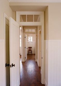 the hallway is clean and ready to be used for storage or remodeling