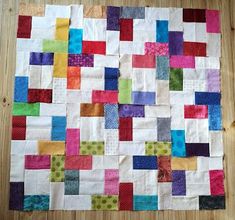 a piece of fabric that has been made into a quilt