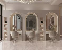 the interior of a salon with chairs, mirrors and chandeliers on display in an elegant setting