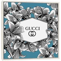 the gucci logo surrounded by flowers and leaves on a blue background canvas wall art print