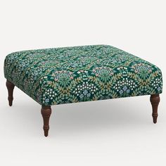 a footstool with a floral pattern on it