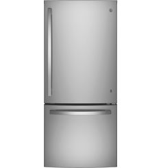 a silver refrigerator freezer sitting on top of a white wall