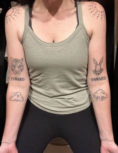 a woman with two tattoos on her arms